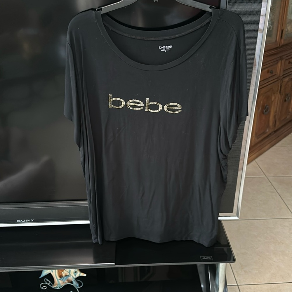 Black BEBE t-shirt with gold logo